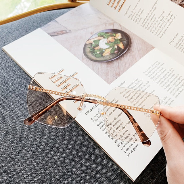 Designer Fashion Oval Rimless Sunglasses Glasses Fashion Men Women UV400 Sunglasses